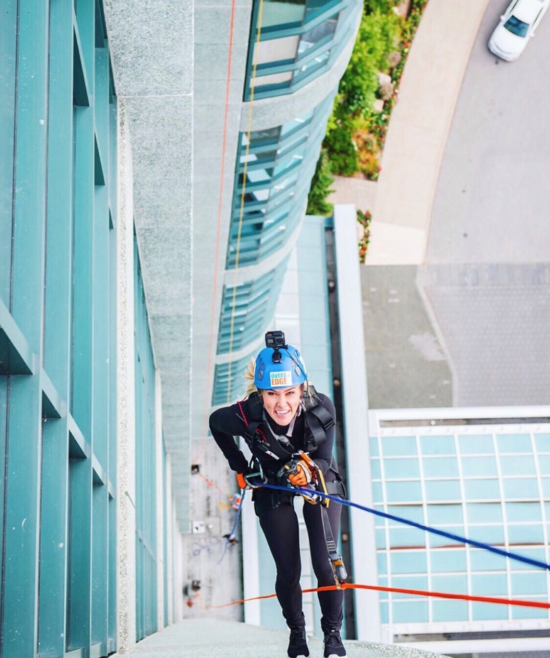 Megan Shaw repelling off building